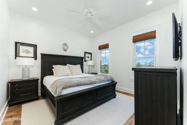 bedroom featuring recessed lighting, wood finished floors, and baseboards