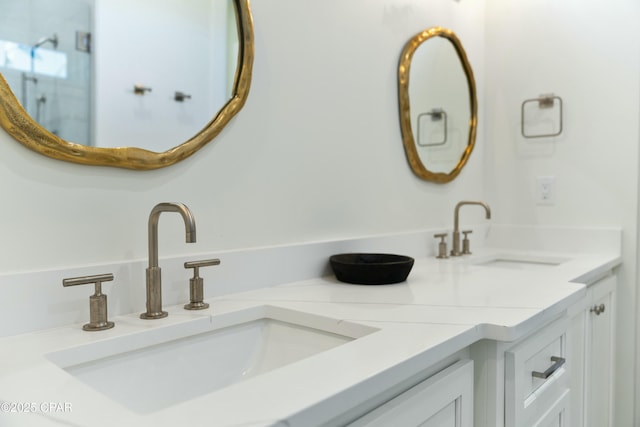 full bath with double vanity and a sink