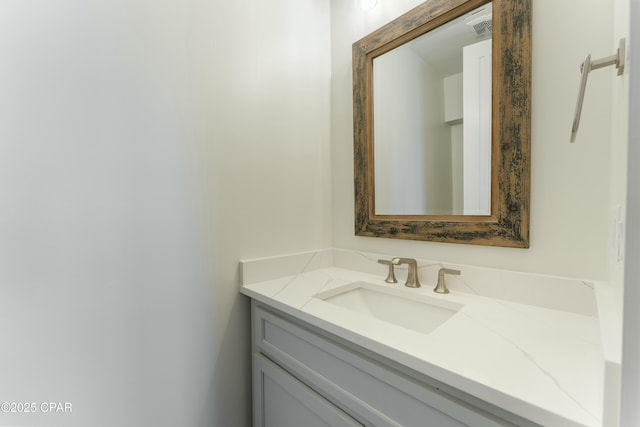 bathroom with visible vents and vanity