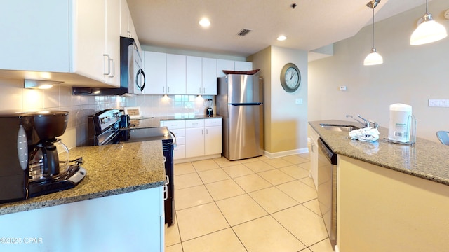 11800 Front Bch Unit 2-407, Panama City Beach, FL 32407 - kitchen with backsplash, a sink, white cabinetry, stainless steel appliances, and visible vents