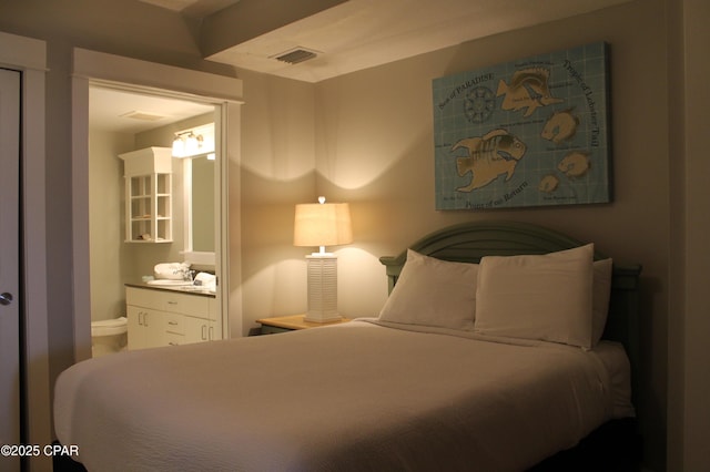 11800 Front Bch Unit 2-407, Panama City Beach, FL 32407 - bedroom featuring ensuite bath and visible vents