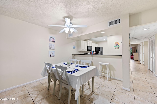 520 N Richard Jackson Blvd Unit 1804, Panama City Beach, FL 32407 - dining space featuring light tile patterned floors, baseboards, a ceiling fan, recessed lighting, and a textured ceiling