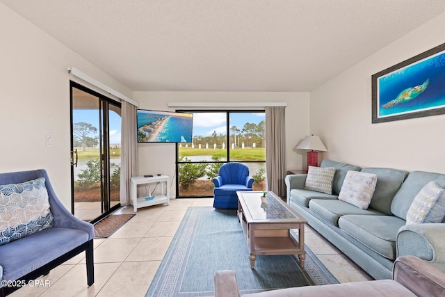 520 N Richard Jackson Blvd Unit 1804, Panama City Beach, FL 32407 - living area with plenty of natural light, light tile patterned flooring, and a textured ceiling