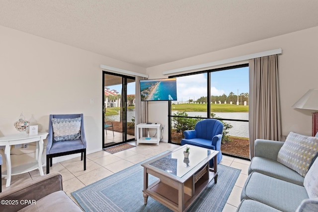 520 N Richard Jackson Blvd Unit 1804, Panama City Beach, FL 32407 - living room with light tile patterned floors and a textured ceiling
