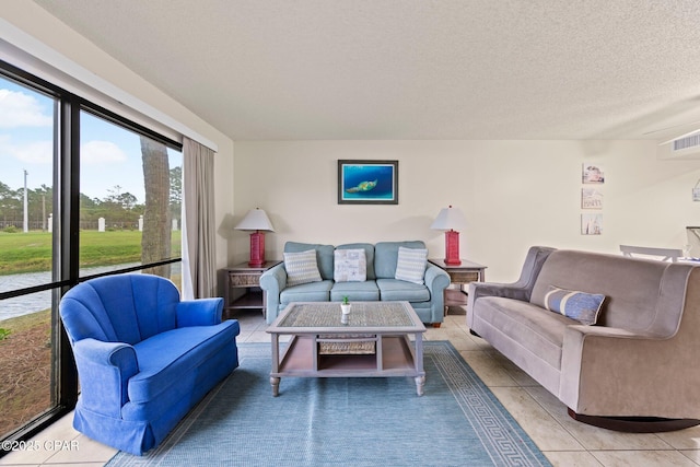 520 N Richard Jackson Blvd Unit 1804, Panama City Beach, FL 32407 - living room featuring light tile patterned flooring and a textured ceiling