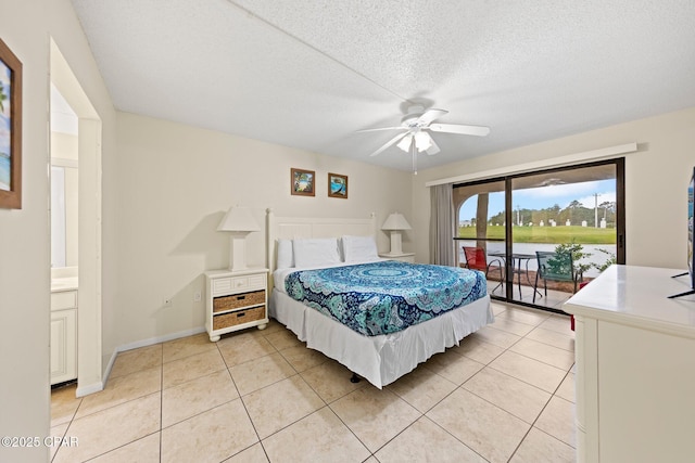 520 N Richard Jackson Blvd Unit 1804, Panama City Beach, FL 32407 - bedroom with access to exterior, light tile patterned floors, baseboards, a textured ceiling, and a ceiling fan