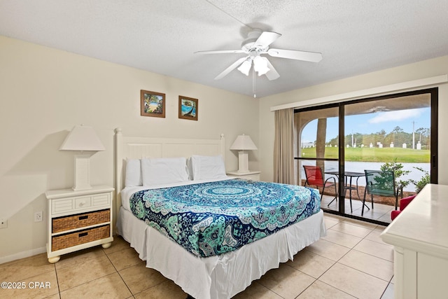 520 N Richard Jackson Blvd Unit 1804, Panama City Beach, FL 32407 - bedroom featuring access to exterior, light tile patterned floors, a textured ceiling, baseboards, and ceiling fan