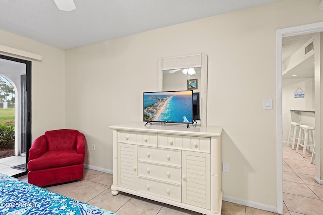 520 N Richard Jackson Blvd Unit 1804, Panama City Beach, FL 32407 - bedroom with light tile patterned floors, a textured ceiling, and baseboards
