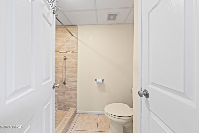 520 N Richard Jackson Blvd Unit 1804, Panama City Beach, FL 32407 - bathroom featuring a tile shower, tile patterned floors, toilet, and baseboards
