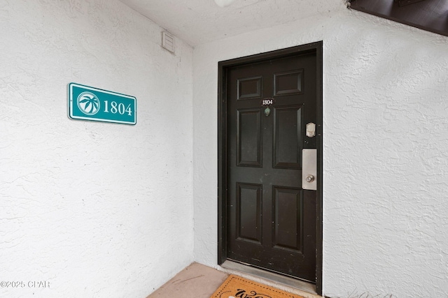 520 N Richard Jackson Blvd Unit 1804, Panama City Beach, FL 32407 - doorway to property featuring stucco siding