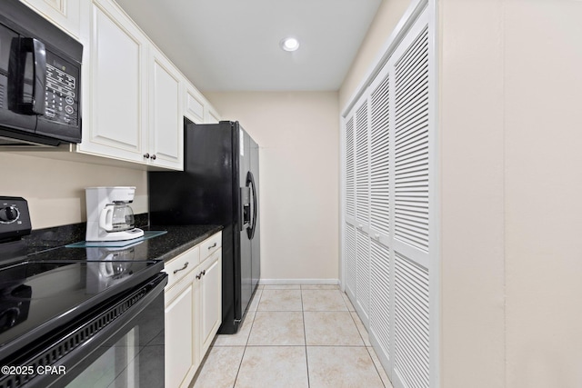 520 N Richard Jackson Blvd Unit 1804, Panama City Beach, FL 32407 - kitchen featuring black appliances, white cabinets, recessed lighting, light tile patterned floors, and baseboards