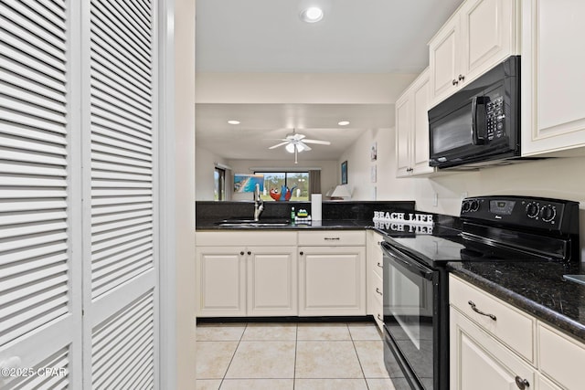 520 N Richard Jackson Blvd Unit 1804, Panama City Beach, FL 32407 - kitchen with black appliances, a sink, light tile patterned floors, recessed lighting, and white cabinets