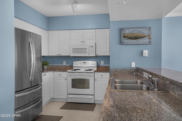 14701 Front Beach Rd Unit 2128, Panama City Beach, FL 32413 - kitchen featuring white appliances, white cabinetry, and light tile patterned floors