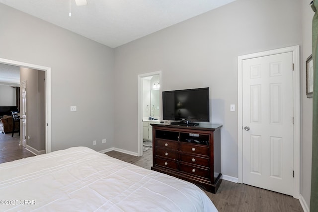 17878 Front Beach Rd Unit B2, Panama City Beach, FL 32413 - bedroom with ensuite bath, baseboards, and wood finished floors