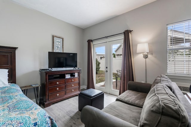 17878 Front Beach Rd Unit B2, Panama City Beach, FL 32413 - bedroom with access to exterior, wood finished floors, and french doors
