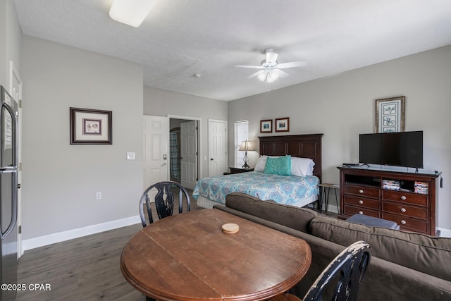 17878 Front Beach Rd Unit B2, Panama City Beach, FL 32413 - bedroom featuring dark wood-type flooring, baseboards, a ceiling fan, and freestanding refrigerator