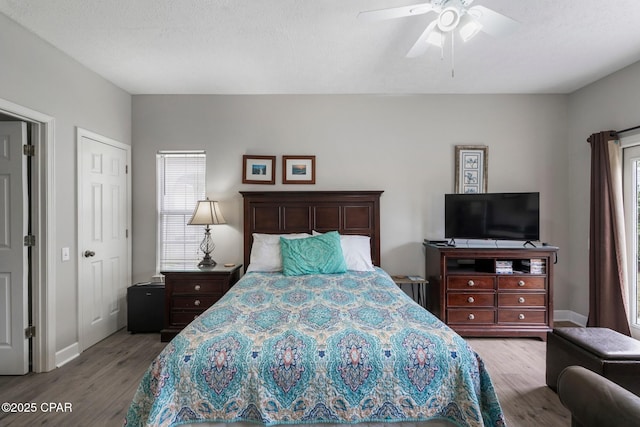 17878 Front Beach Rd Unit B2, Panama City Beach, FL 32413 - bedroom featuring a textured ceiling, baseboards, ceiling fan, and wood finished floors