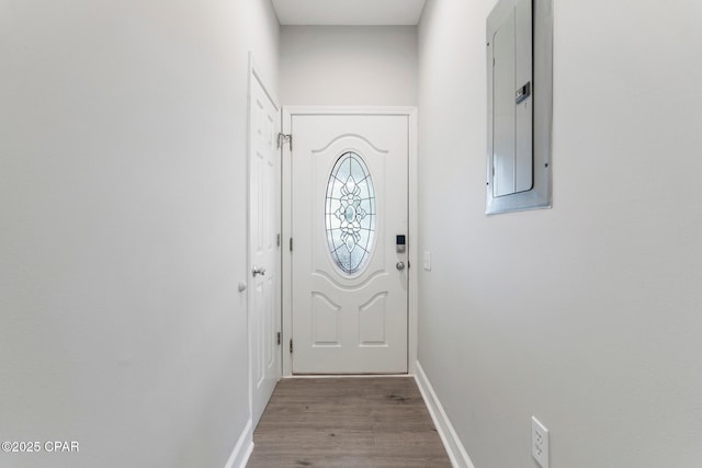 17878 Front Beach Rd Unit B2, Panama City Beach, FL 32413 - entryway featuring baseboards, wood finished floors, and electric panel