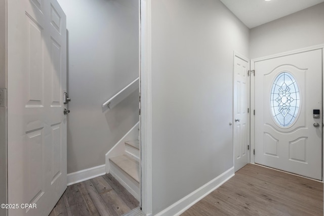 17878 Front Beach Rd Unit B2, Panama City Beach, FL 32413 - foyer entrance with baseboards, wood finished floors, and stairway