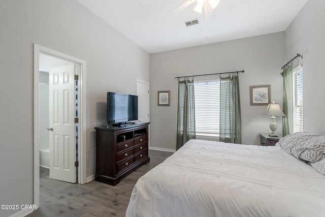 17878 Front Beach Rd Unit B2, Panama City Beach, FL 32413 - bedroom featuring wood finished floors, baseboards, multiple windows, and visible vents