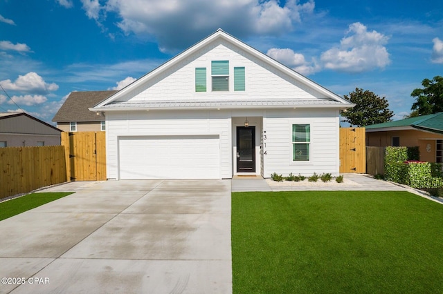 314 Tanaga St, Panama City Beach, FL 32413 - view of front of home with a gate, a garage, and concrete driveway