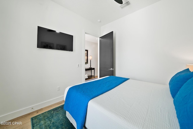 314 Tanaga St, Panama City Beach, FL 32413 - bedroom with wood finished floors and baseboards