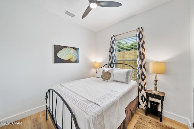 314 Tanaga St, Panama City Beach, FL 32413 - bedroom featuring baseboards, light wood finished floors, and a ceiling fan