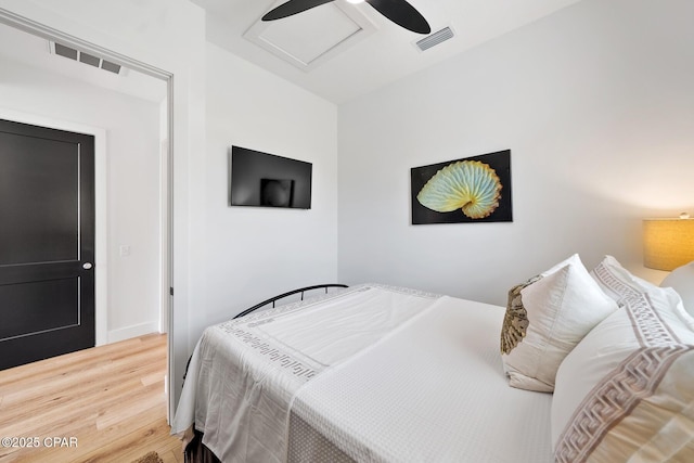 314 Tanaga St, Panama City Beach, FL 32413 - bedroom featuring wood finished floors, ceiling fan, and attic access