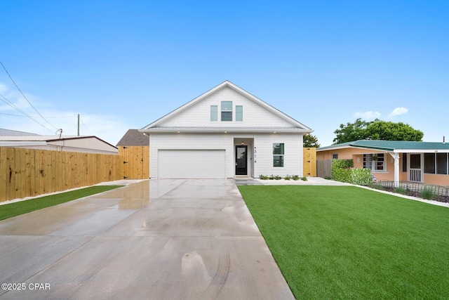 314 Tanaga St, Panama City Beach, FL 32413 - view of front of home with driveway and a garage