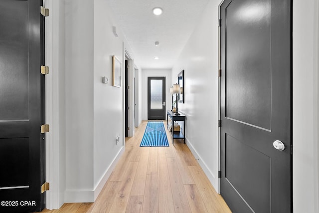 314 Tanaga St, Panama City Beach, FL 32413 - corridor with baseboards, light wood-style flooring, and recessed lighting