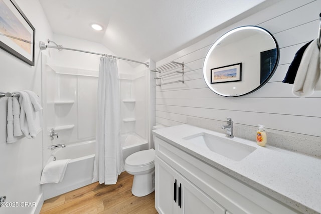 314 Tanaga St, Panama City Beach, FL 32413 - bathroom featuring toilet, wood finished floors, vanity, shower / bath combo, and vaulted ceiling