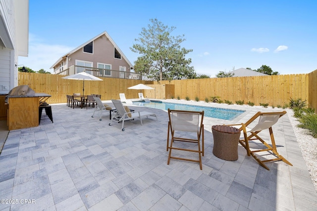 314 Tanaga St, Panama City Beach, FL 32413 - view of pool featuring a fenced backyard, a patio, outdoor dining space, and grilling area