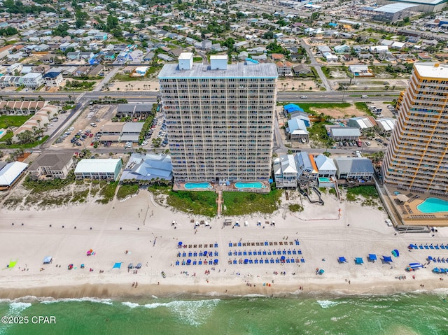 bird's eye view with a water view and a view of the beach