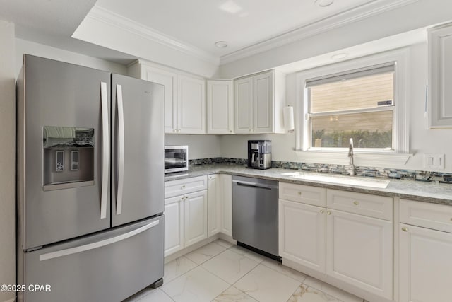 1606 Belmont Blvd, Lynn Haven, FL 32444 - kitchen featuring appliances with stainless steel finishes, light marble finish floors, white cabinetry, crown molding, and light stone countertops