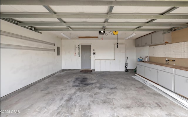 1606 Belmont Blvd, Lynn Haven, FL 32444 - garage with a garage door opener and electric panel