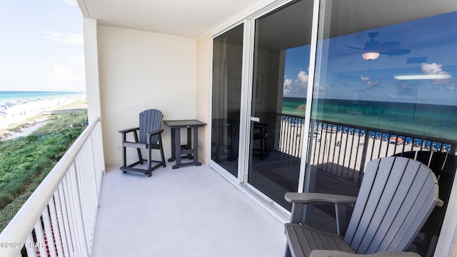 balcony featuring view of water and beach
