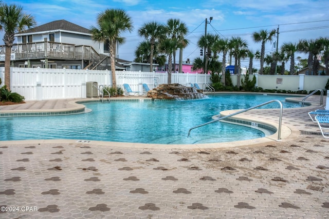community pool featuring fence