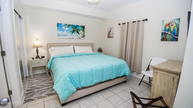 bedroom featuring light tile patterned flooring