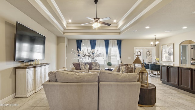 221 S Shoreview Dr, Panama City, FL 32404 - living area featuring a ceiling fan, light tile patterned flooring, a raised ceiling, arched walkways, and recessed lighting