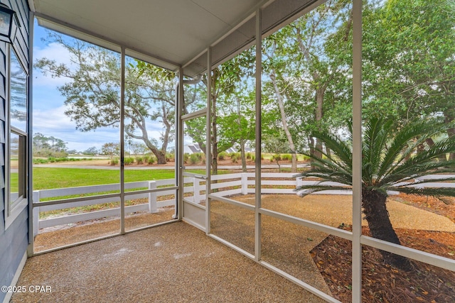 unfurnished sunroom featuring a wealth of natural light
