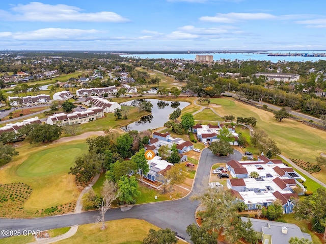 drone / aerial view featuring a residential view, a water view, and golf course view