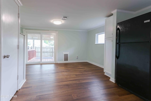 911 Indiana Ave, Lynn Haven, FL 32444 - empty room featuring crown molding and dark wood-type flooring