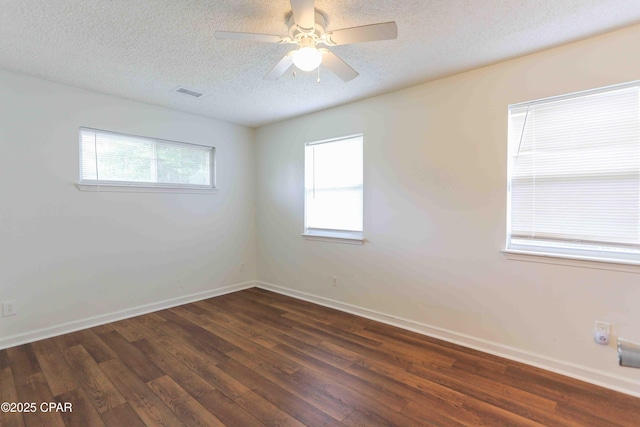 911 Indiana Ave, Lynn Haven, FL 32444 - unfurnished room featuring dark wood-style floors, a textured ceiling, and a ceiling fan