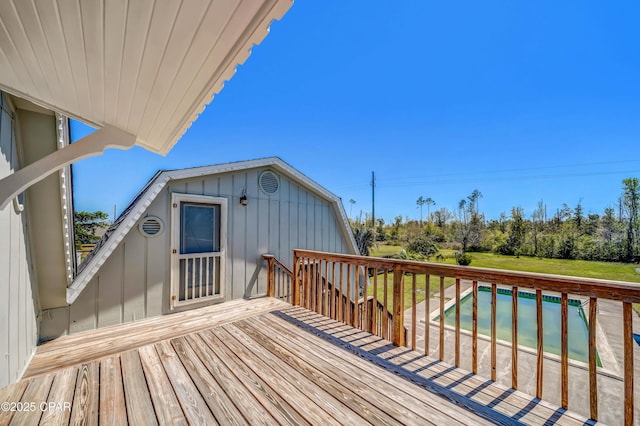 wooden deck featuring an outdoor pool