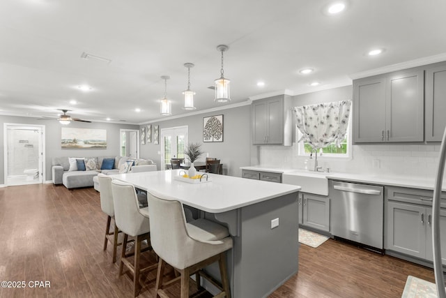 2187 Mayo Rd, Grand Ridge, FL 32442 - kitchen featuring stainless steel dishwasher, gray cabinetry, a sink, a center island, and backsplash
