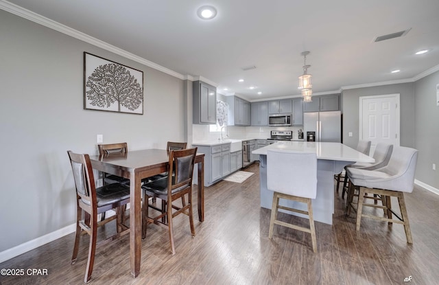 2187 Mayo Rd, Grand Ridge, FL 32442 - dining room with crown molding, baseboards, dark wood-type flooring, and recessed lighting