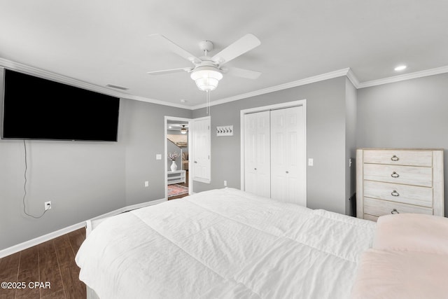 2187 Mayo Rd, Grand Ridge, FL 32442 - bedroom featuring dark wood-style flooring, ornamental molding, a closet, baseboards, and a ceiling fan