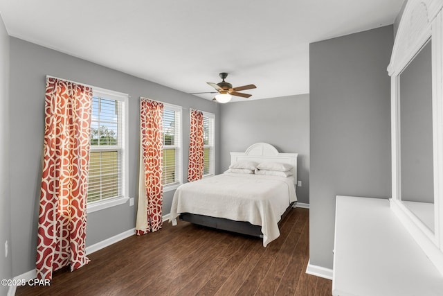 2187 Mayo Rd, Grand Ridge, FL 32442 - bedroom featuring dark wood-style floors, baseboards, and a ceiling fan