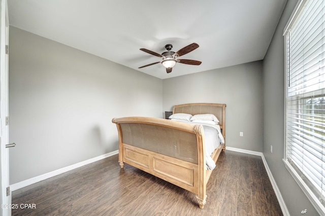 2187 Mayo Rd, Grand Ridge, FL 32442 - bedroom featuring wood finished floors, baseboards, and a ceiling fan