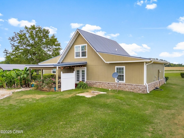2187 Mayo Rd, Grand Ridge, FL 32442 - rear view of house featuring french doors and a lawn
